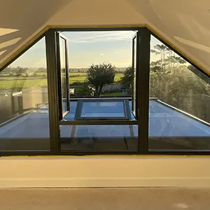a room with a large window and a view of a field