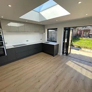 a large open kitchen with a skylight above it